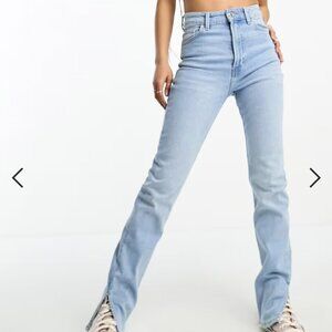 Bershka Petite slit hem jeans in light blue in US 10